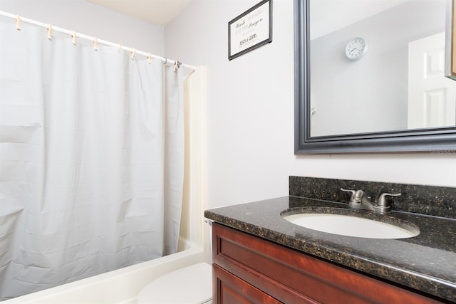 full bathroom with toilet, vanity, and shower / tub combo with curtain