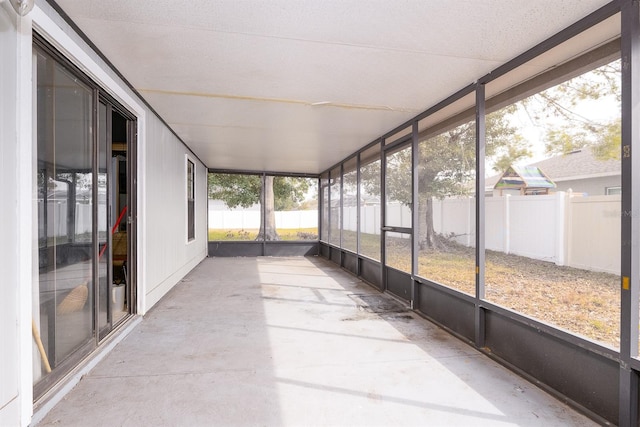 unfurnished sunroom featuring a wealth of natural light