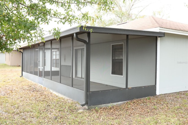 view of side of home with a sunroom