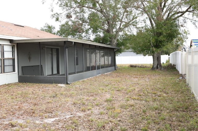 view of yard featuring a sunroom