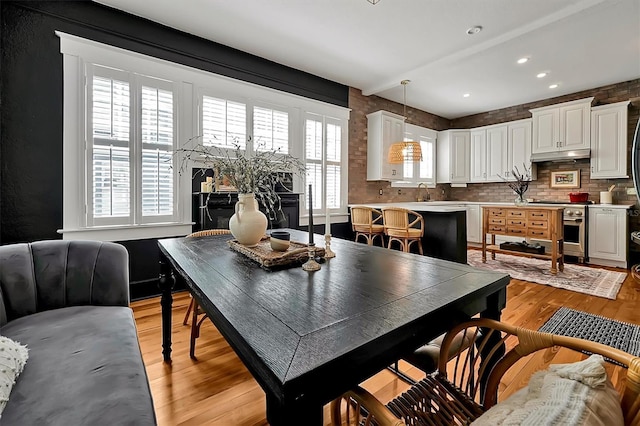 dining space featuring recessed lighting and light wood-style floors