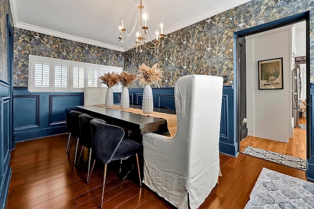 dining area featuring hardwood / wood-style floors, crown molding, and wallpapered walls