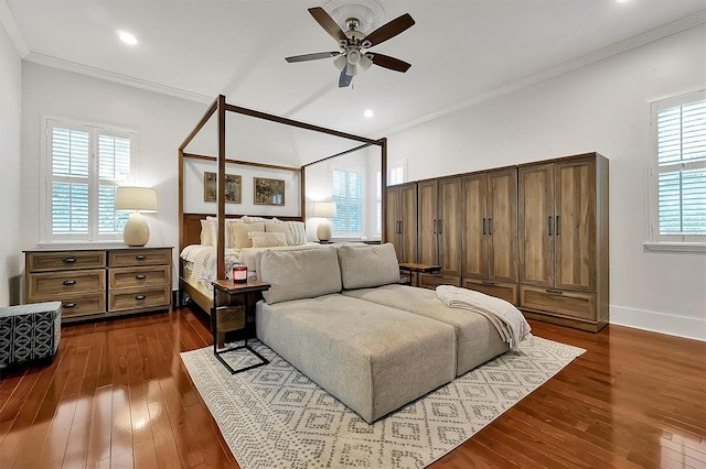 bedroom with crown molding, baseboards, and dark wood-style flooring