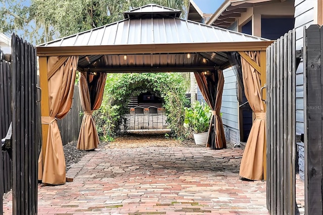 view of patio / terrace featuring a gazebo and fence