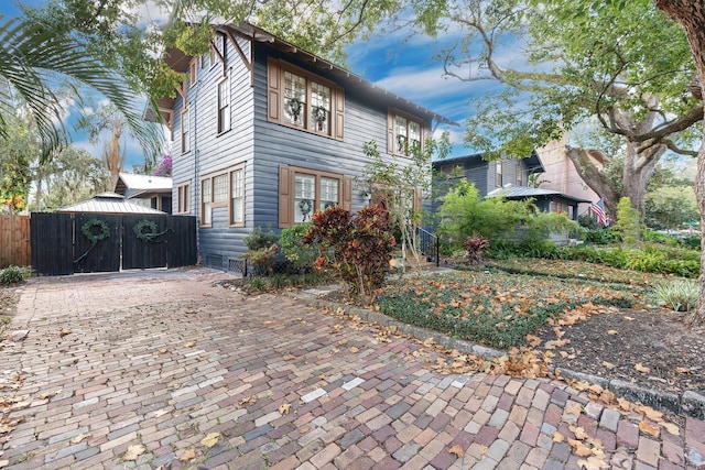 view of front of house with fence