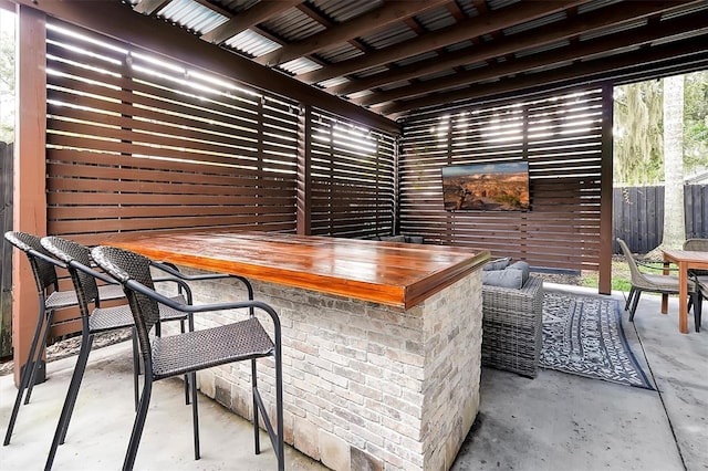 bar featuring concrete flooring