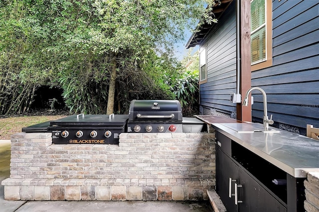 view of patio with a sink, area for grilling, and an outdoor kitchen