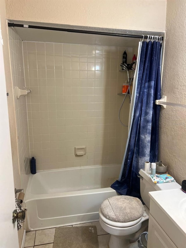 full bathroom with toilet, vanity, tile patterned floors, and shower / bath combo with shower curtain