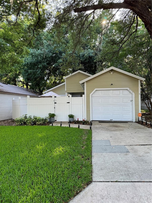 ranch-style home with a front yard and a garage