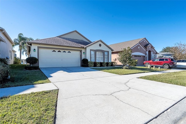 ranch-style home featuring a garage and a front lawn