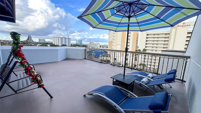 view of patio featuring a balcony