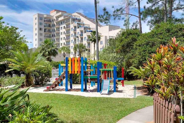 view of playground with a lawn