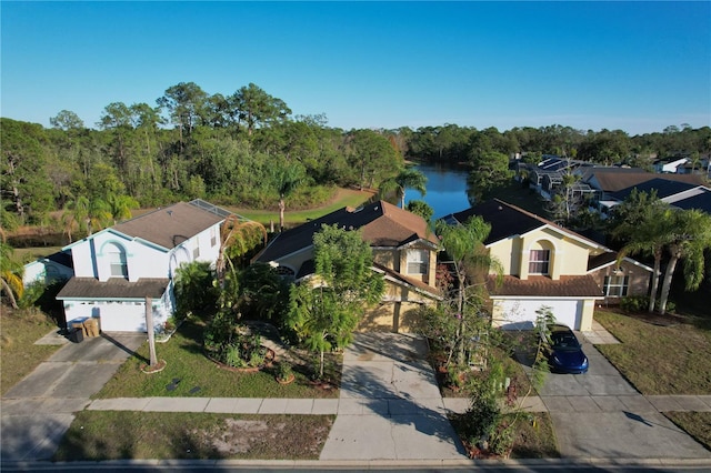 birds eye view of property with a water view