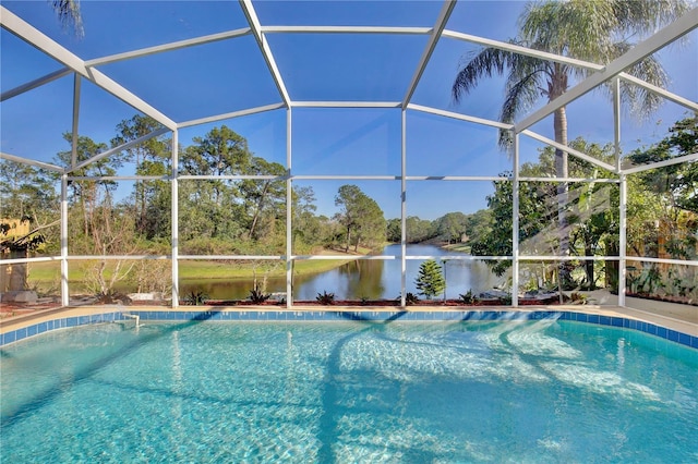 view of swimming pool with a water view and a lanai