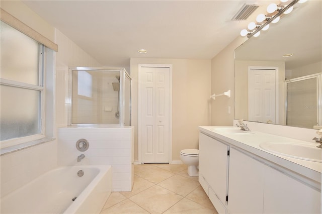 full bathroom with tile patterned flooring, plus walk in shower, vanity, and toilet