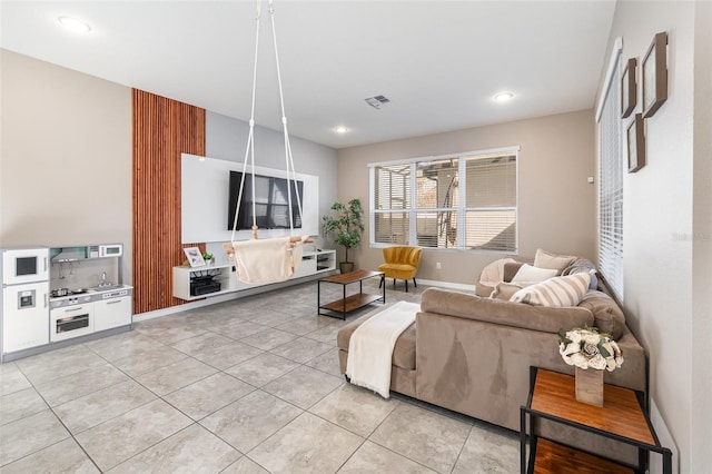 living room with tile patterned floors