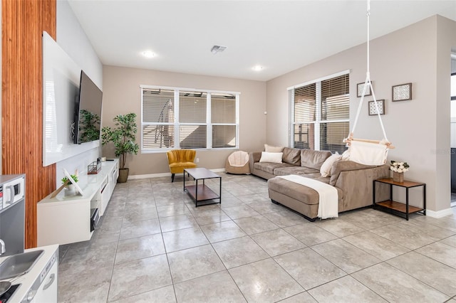 living room with light tile patterned floors