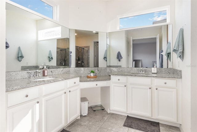 bathroom with vanity, tile patterned floors, and an enclosed shower