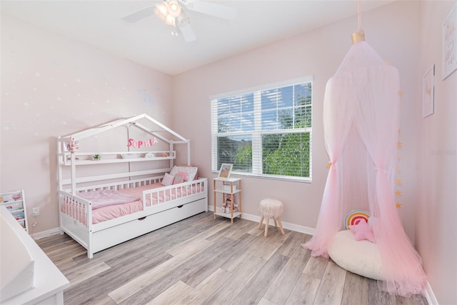 bedroom featuring ceiling fan and light hardwood / wood-style floors