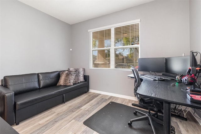 office space with light hardwood / wood-style floors