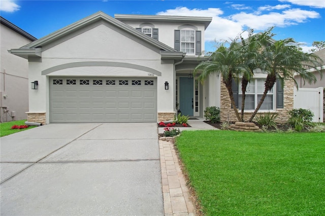 view of front of home with a garage and a front yard