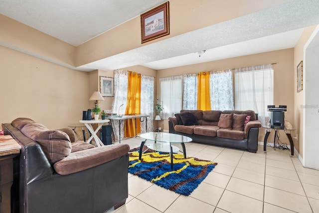 living room with light tile patterned floors and a textured ceiling