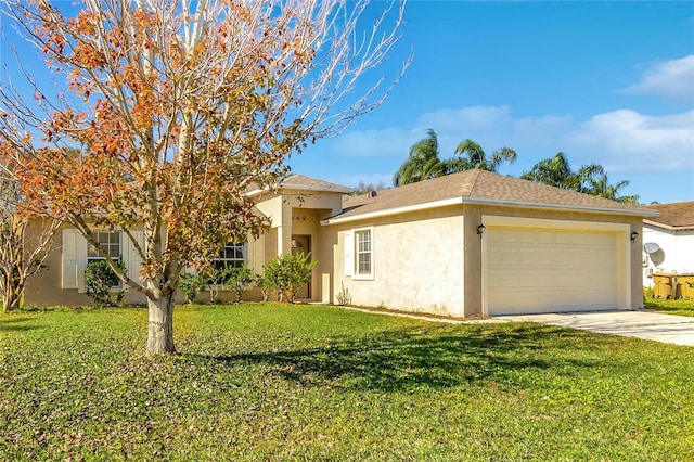 view of front of home with a front yard and a garage