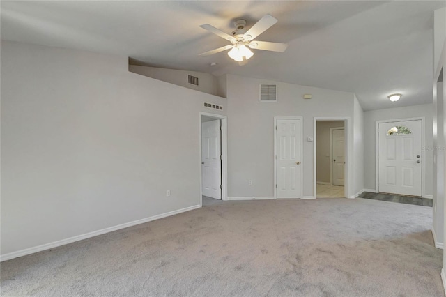 unfurnished room with ceiling fan, light carpet, and lofted ceiling