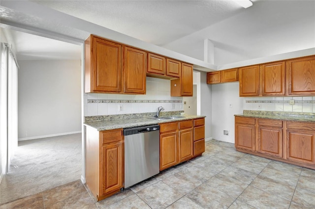 kitchen with light stone countertops, tasteful backsplash, sink, light colored carpet, and stainless steel dishwasher