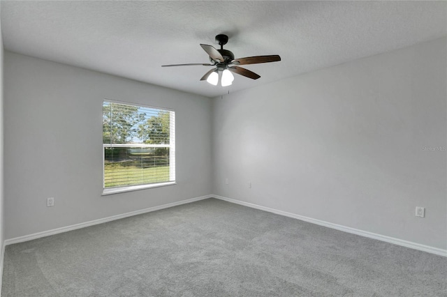 empty room with carpet floors and ceiling fan