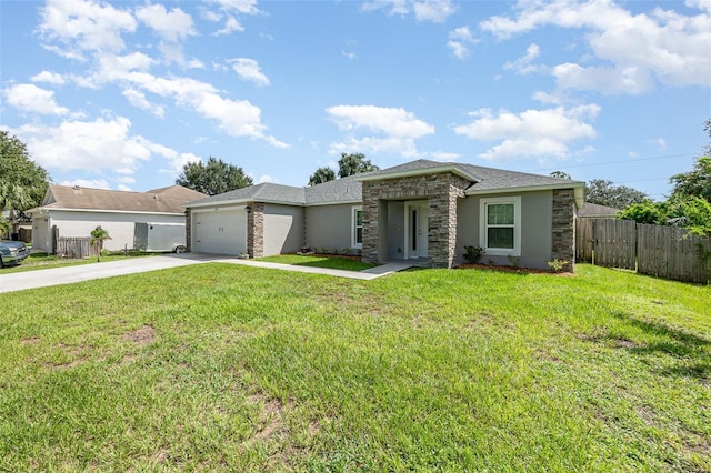 view of front of home featuring a front yard and a garage