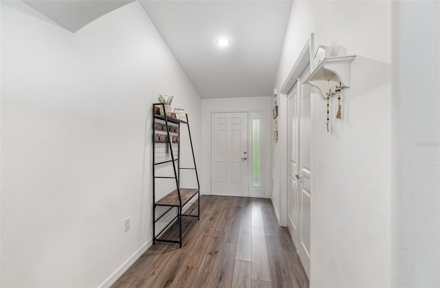 hallway with light hardwood / wood-style floors