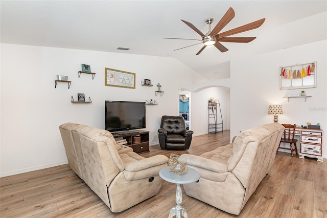 living room with ceiling fan, lofted ceiling, and light wood-type flooring