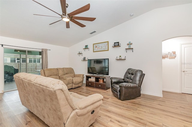 living room featuring ceiling fan, light hardwood / wood-style flooring, and lofted ceiling