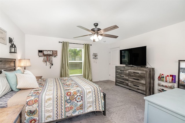 bedroom featuring ceiling fan and light carpet