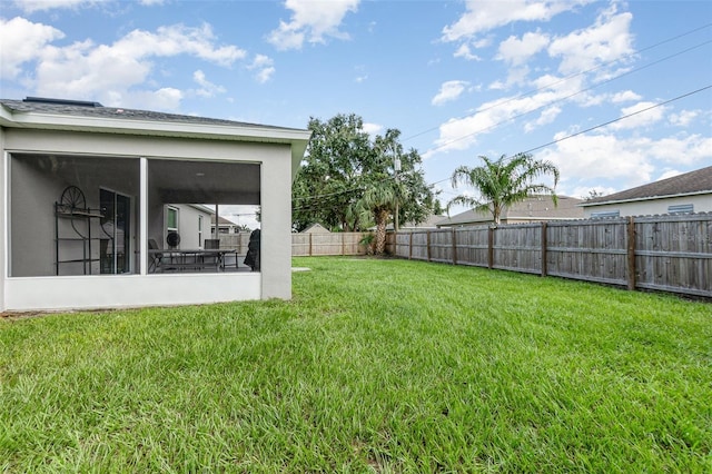 view of yard featuring a sunroom