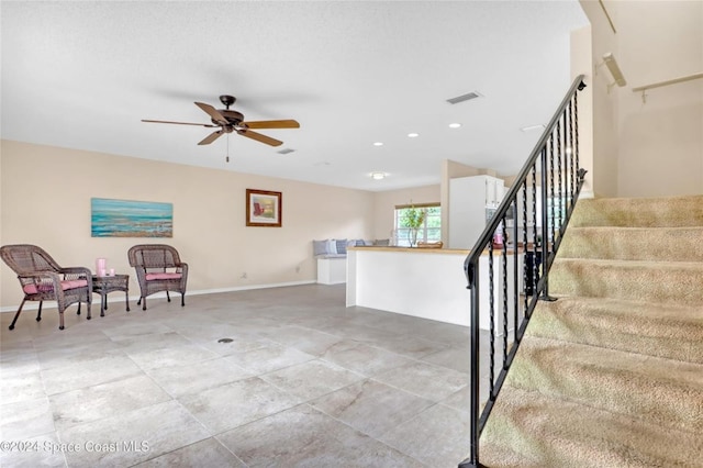 stairs with ceiling fan