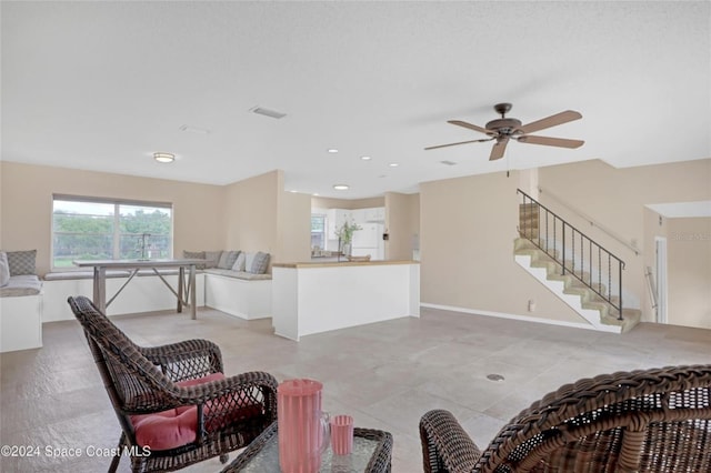 living room featuring ceiling fan