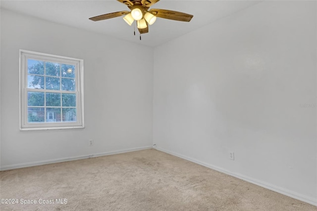 carpeted empty room with ceiling fan