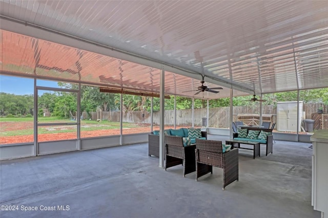 view of patio with an outdoor living space and ceiling fan