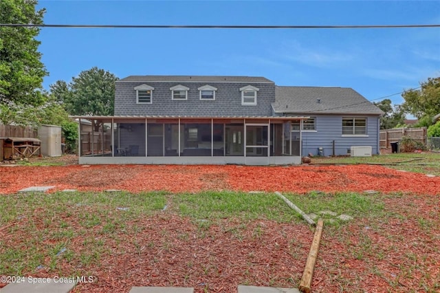 back of house featuring a sunroom