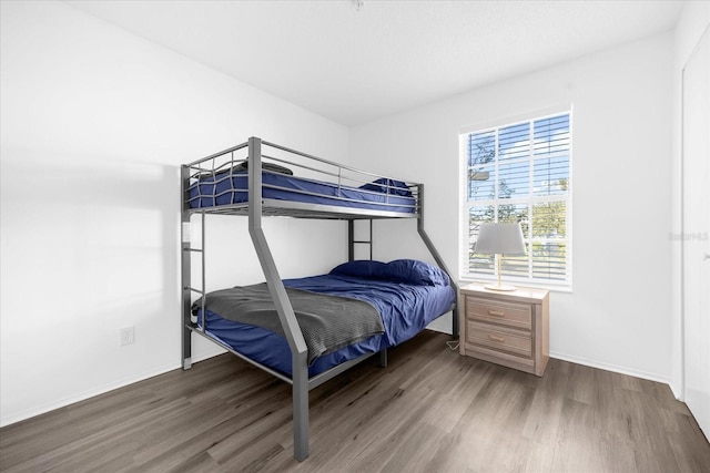 bedroom with wood-type flooring