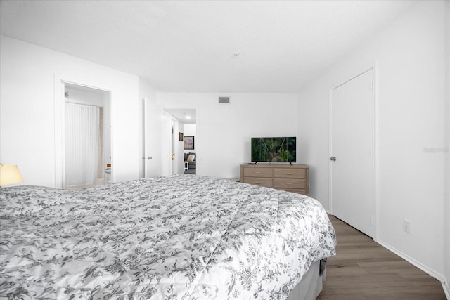 bedroom featuring hardwood / wood-style flooring