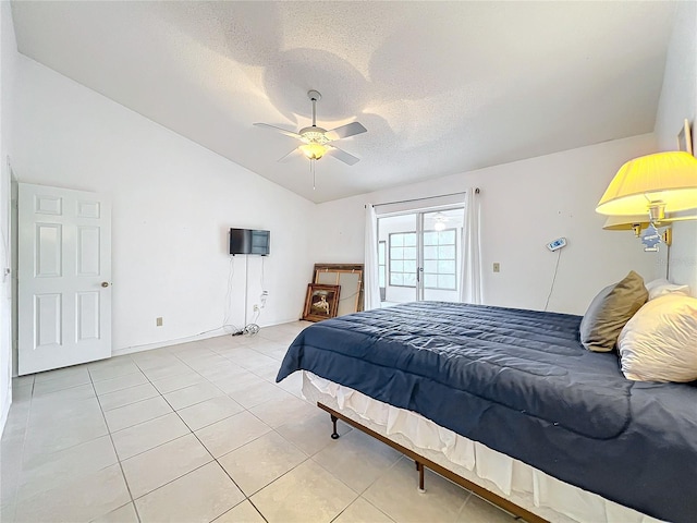 tiled bedroom featuring a textured ceiling, access to exterior, ceiling fan, and vaulted ceiling