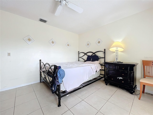 bedroom featuring ceiling fan and light tile patterned floors