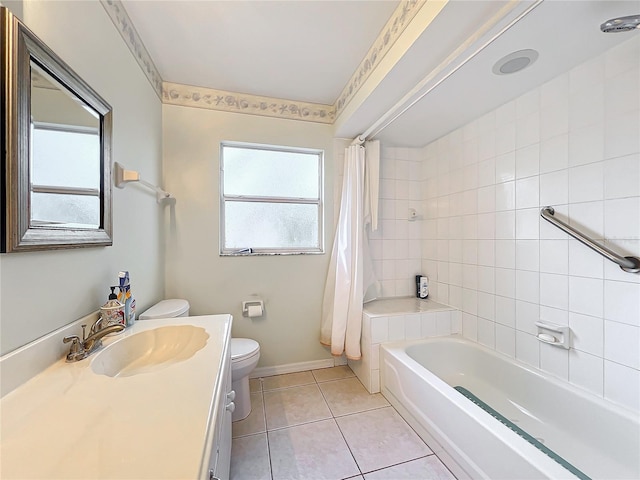 full bathroom featuring toilet, shower / bath combo, vanity, and tile patterned floors