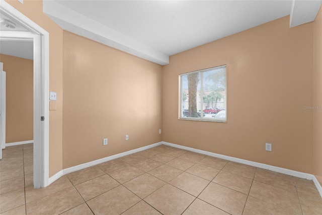 unfurnished room featuring light tile patterned floors