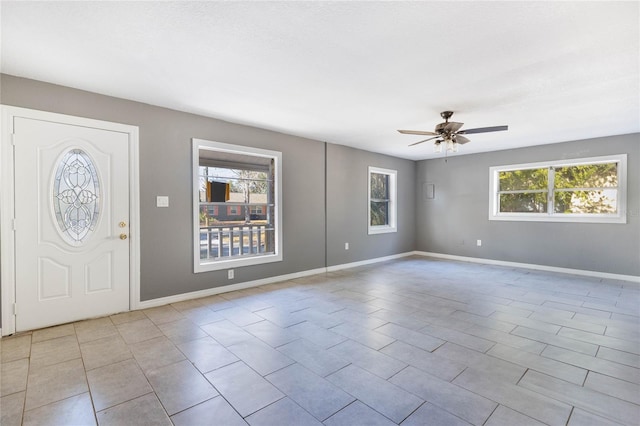 foyer entrance with ceiling fan