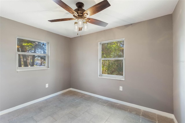 spare room with ceiling fan