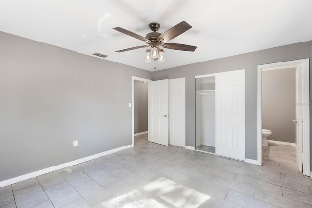 unfurnished bedroom featuring ceiling fan and ensuite bath